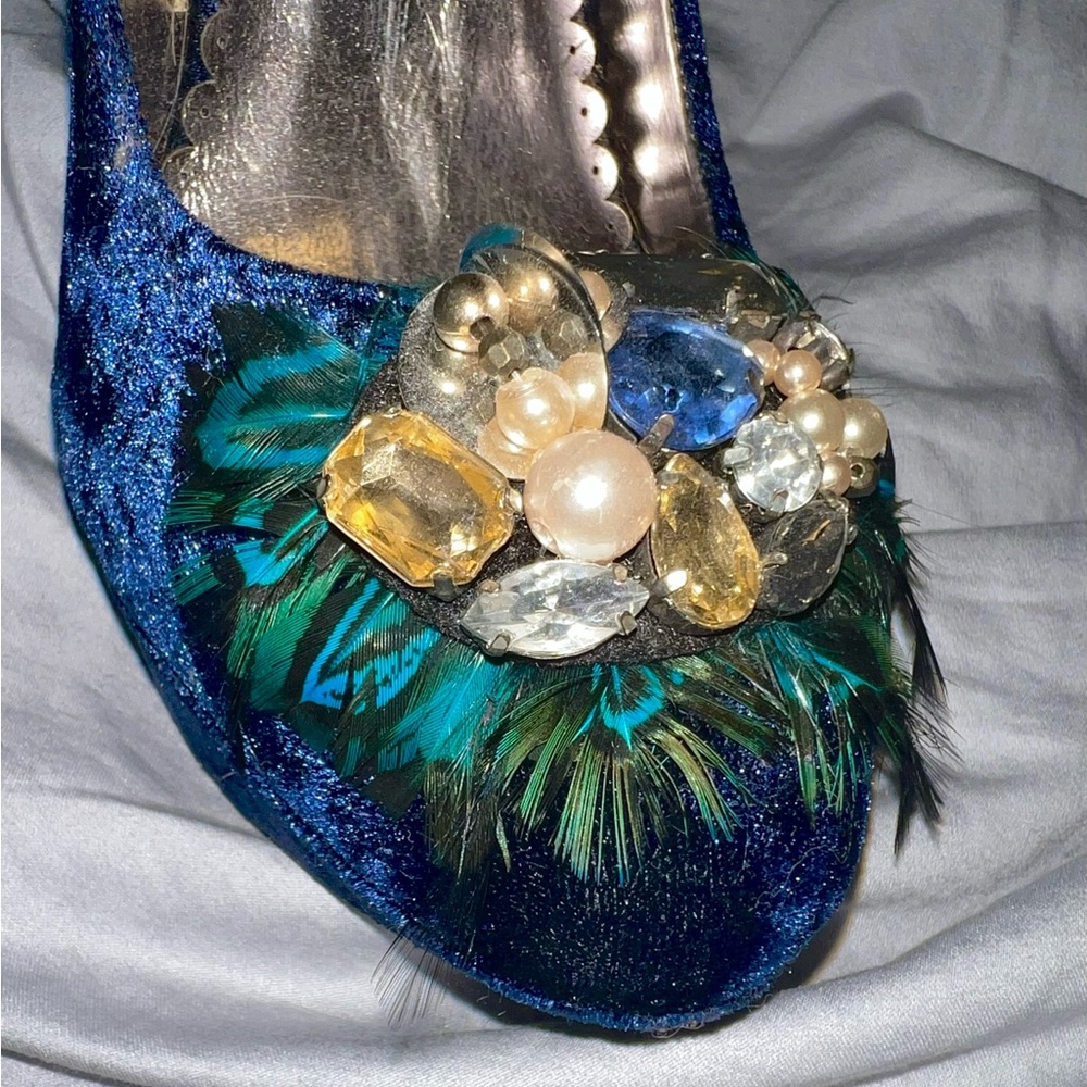 Blue velvet heels with jewels and peacock feathers embellishments